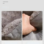 Bed for Cats gray plush cushion with soft, comfortable texture shown in close-up with hand squeezing the fabric