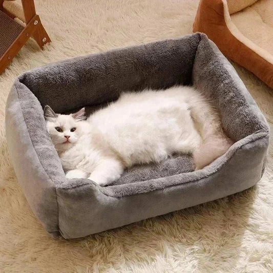 Bed for Cats plush grey rectangular pet bed with raised sides and soft interior shown with a white cat lying inside