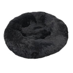 Donut Mand Dog Accessories round pet bed in black plush fabric, with a thick raised cushioned rim and soft center.